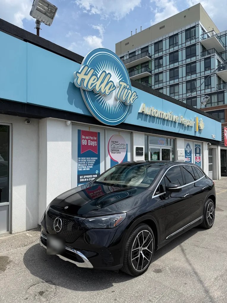 A black Mercedes SUV parked outside Hello Tire