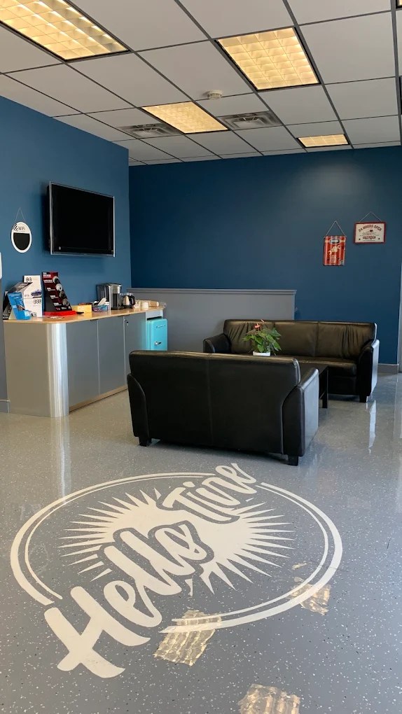 The customer lounge with leather sofas and a coffee counter